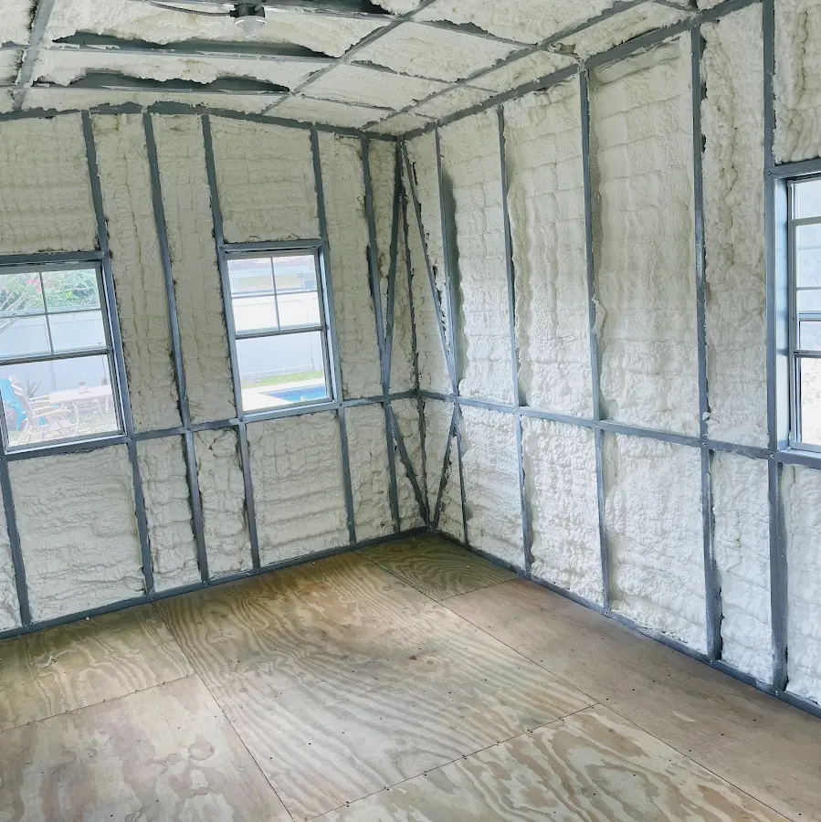 Closed-cell spray foam insulation applied to wall cavities in a residential project in Gouverneur